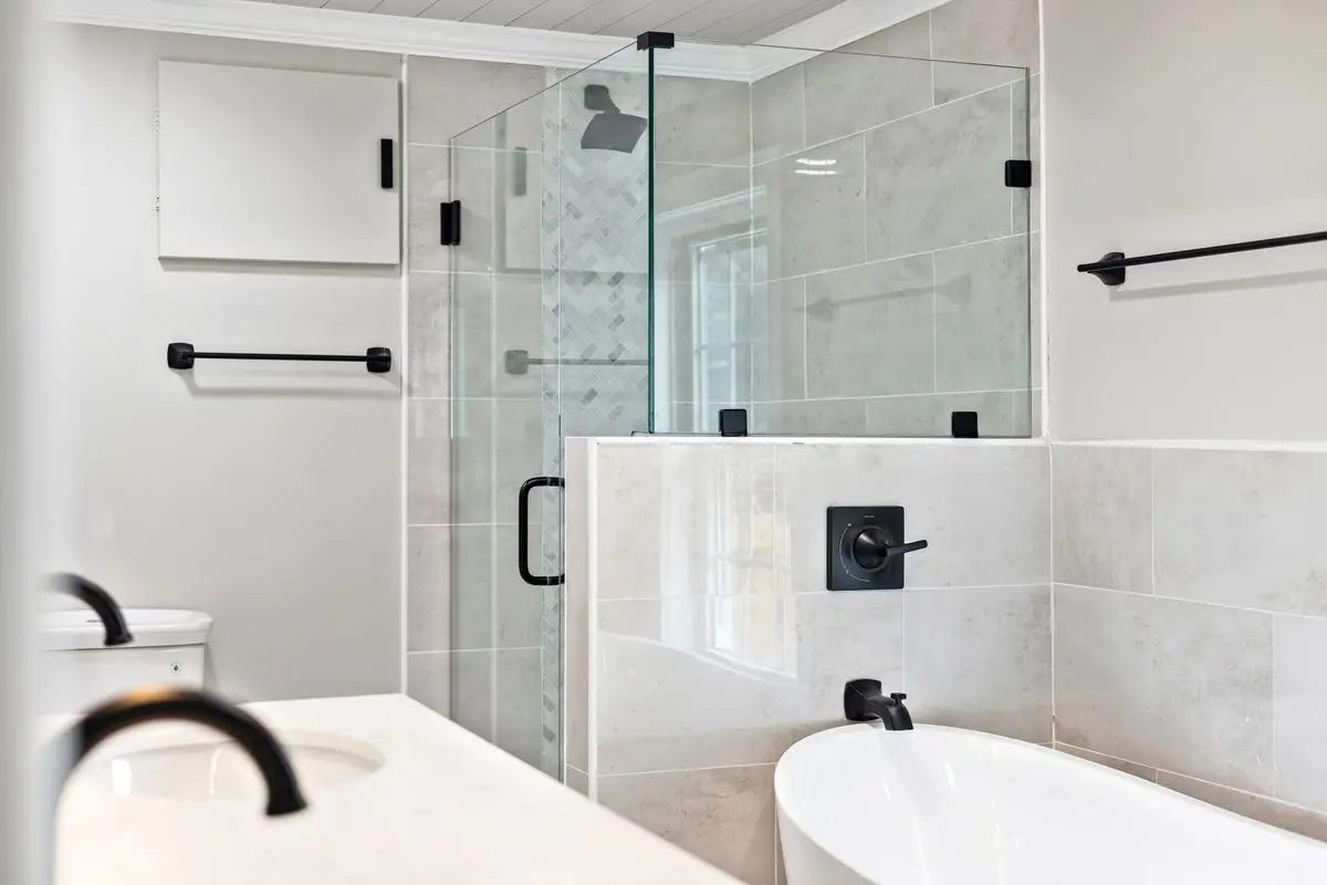 A clean, well-lit residential bathroom. Arlington.