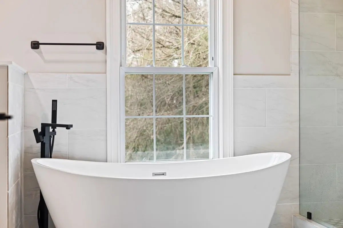 A clean, well-lit residential bathroom. Arlington.