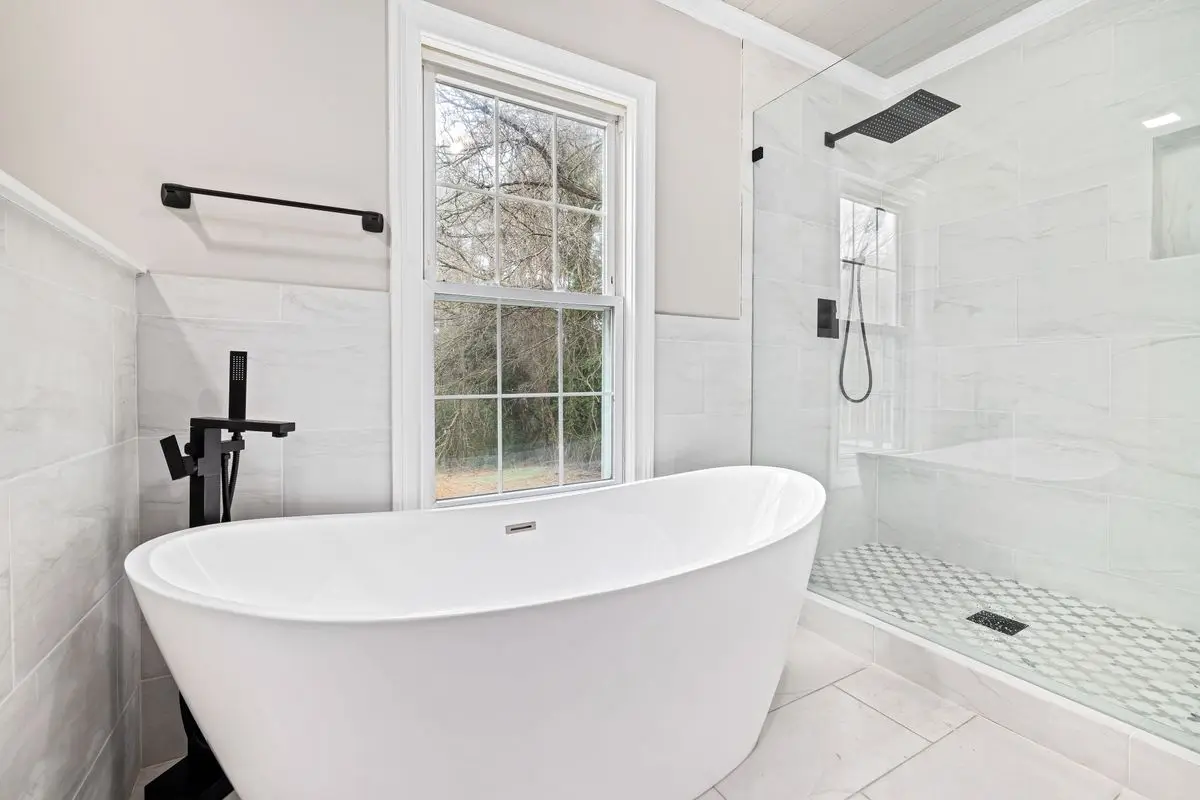 A clean, well-lit residential bathroom. Arlington.